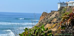 Looking north towards the northern border of Solana Beach, a good wave is breaking on a crisp February afternoon at Seaside State Beach.